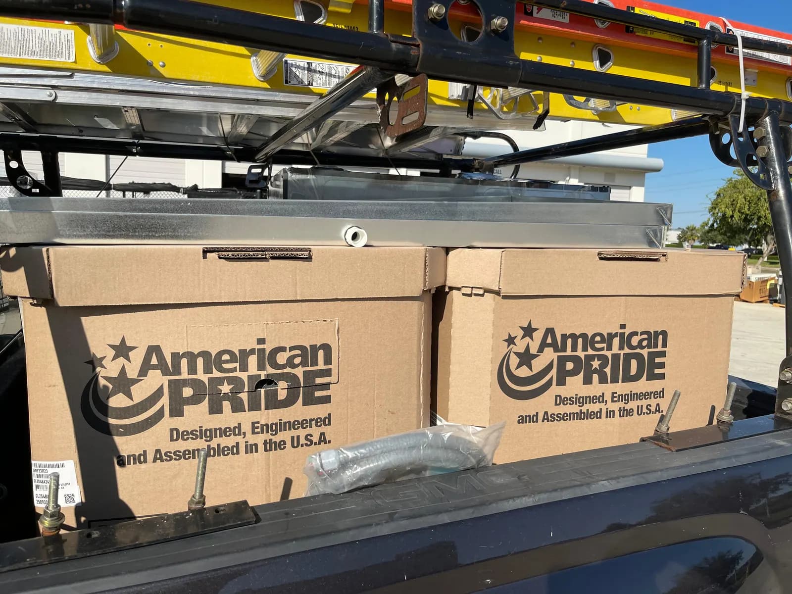 Boxed Goodman GLZS4BA R-32 condensing units loaded on our service truck in Orlando